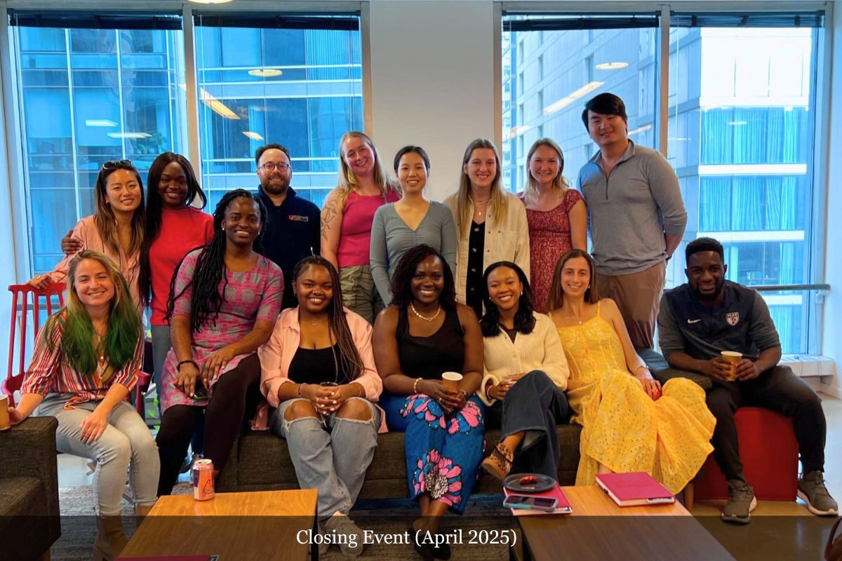 1 A diverse group of people gathered in an office setting, smiling and posing for a photo. The text indicates it is a closing event in April 2025.